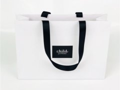Paper bag with custom logo patch
