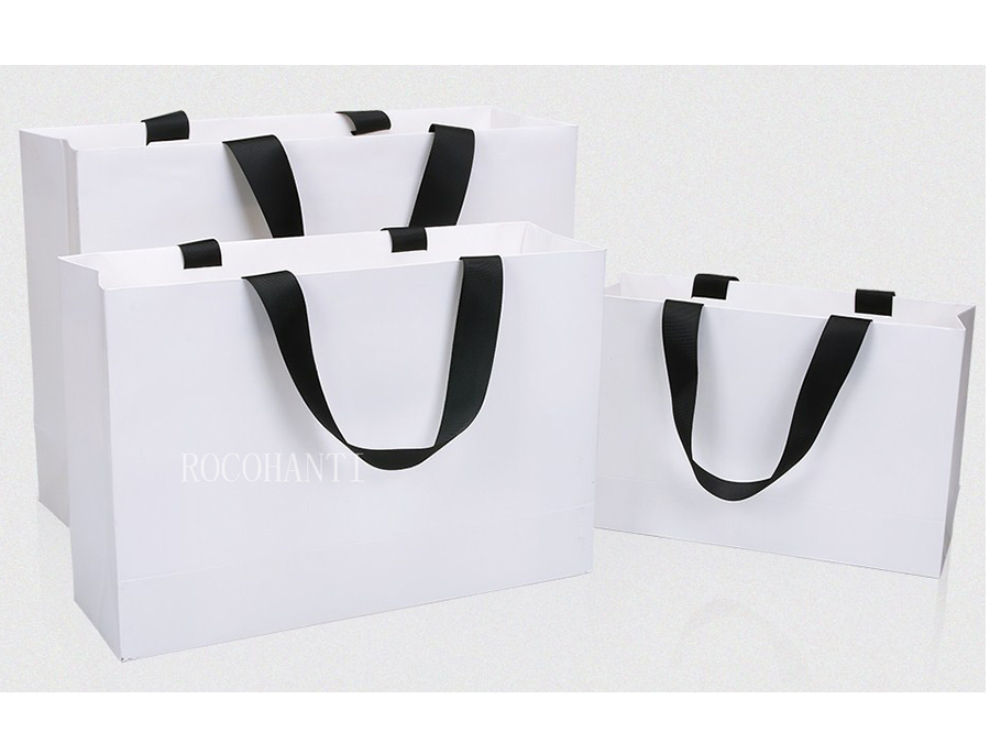 White paper bag with black ribbon